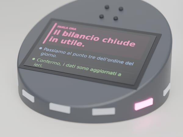 Rendering di concetto: un disco al centro di un tavolo da riunione, con un anello di LED di cui uno acceso in magenta e un display da 5 pollici che mostra la frase di chi sta parlando in magenta e gli interventi precedenti, ciascuno nel colore di chi li ha detti.