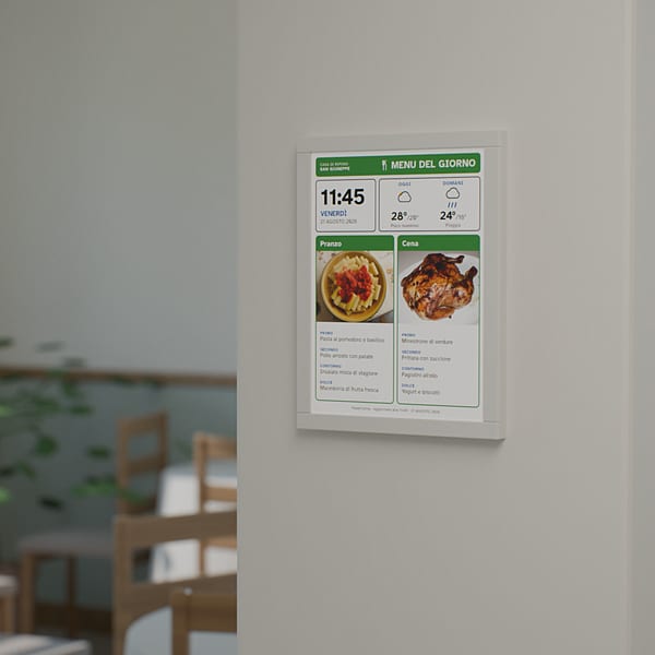 The dining room of a care home: an eInk label on the pillar shows the day's menu, with a photograph of each course.